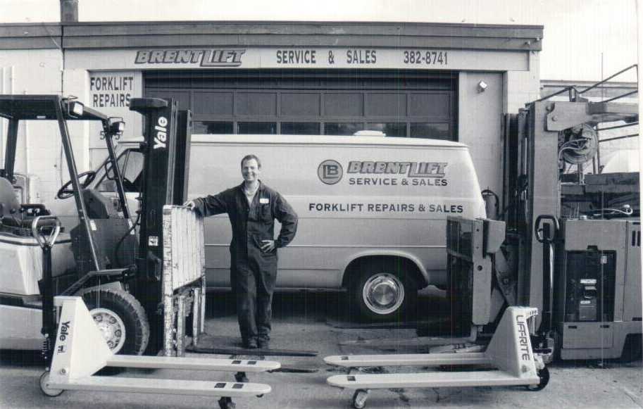 Brent from Brentlift stands in front of one of his trucks.